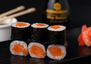 A Japanese style sushi roll, where the Nori is the outermost layer of the roll. 