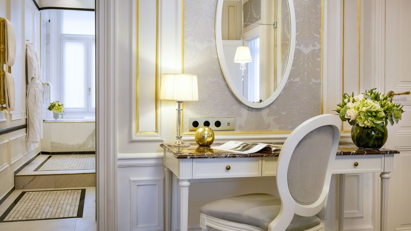 Lavish work area with a mirror on the wall in the Duke of Westminster Suite at Hôtel Westminster - Paris