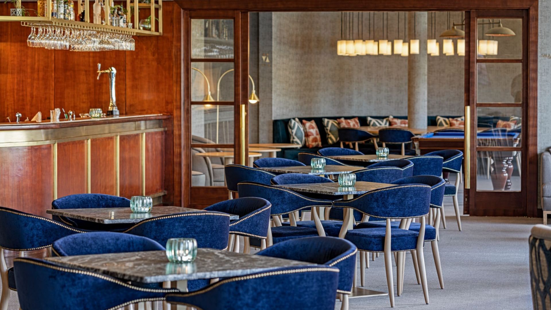 Dining tables arranged by the counter area in Fanal bar at Terceira Mar Hotel