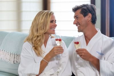 Couple having a friendly chat at the Spa in Somerset Grace Bay