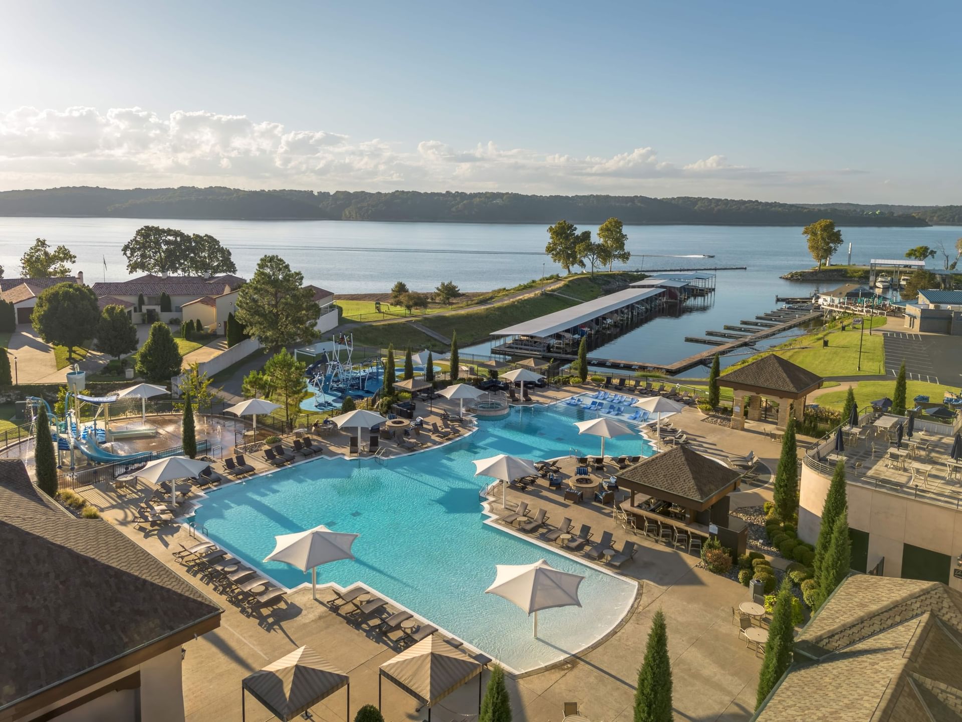 Aerial view of exterior pool featuring the lake at The Pool Bar at Shangri La Resort and Golf Club