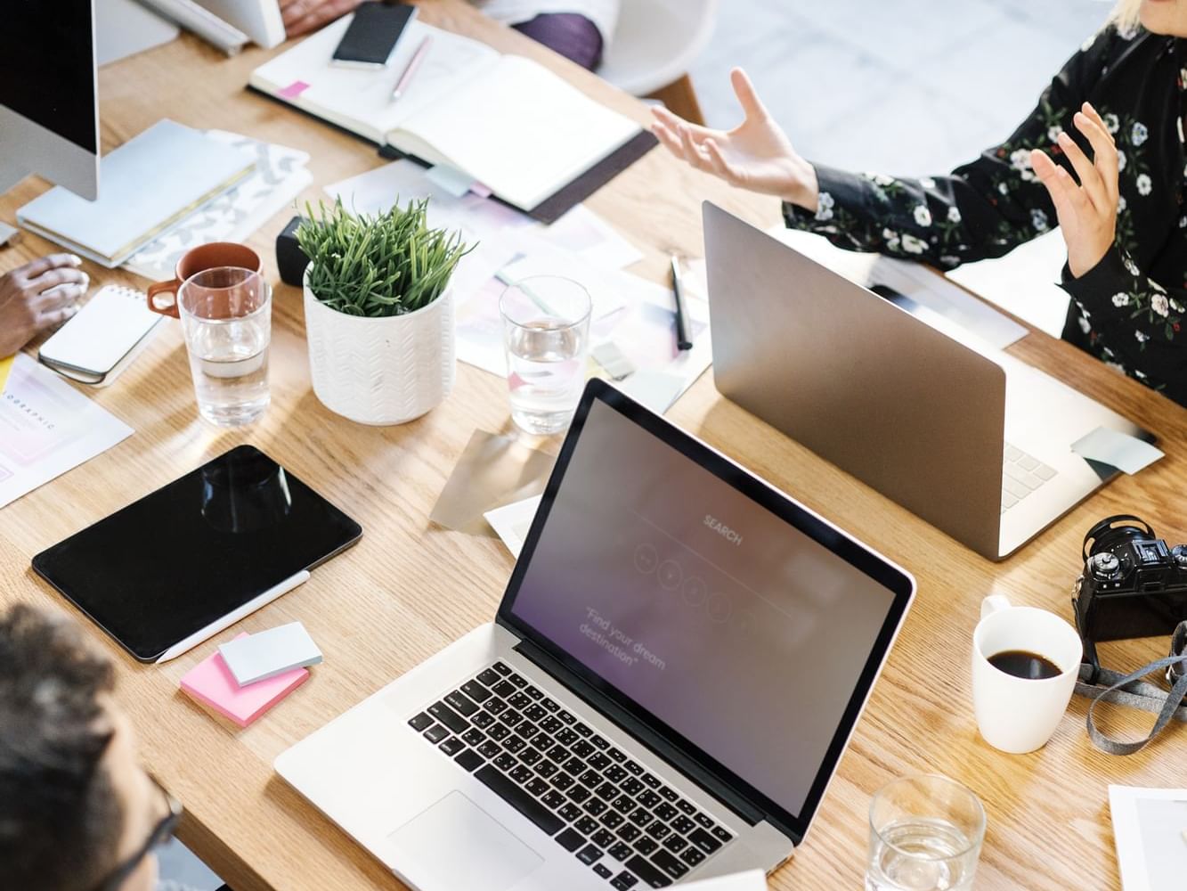 Closeup of a meeting table with laptops at Originals Hotels