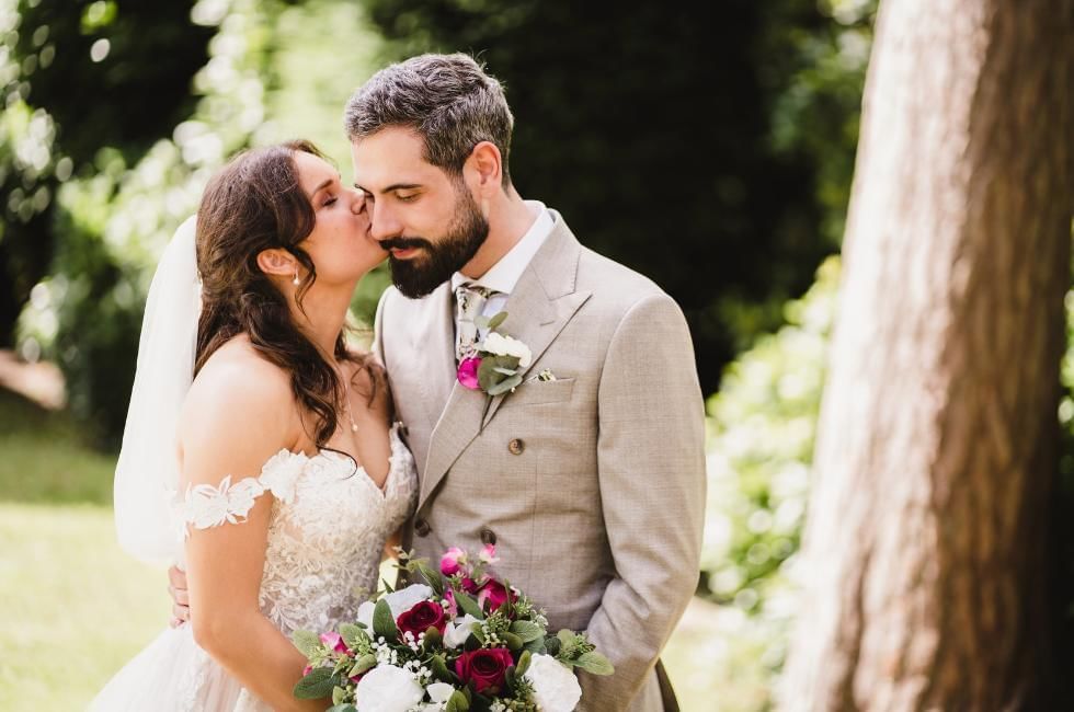 Bride and groom in the gardens at Gorse Hill one of the best wedding venues in Surrey