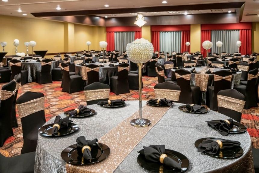 Banquet tables setup in Dallas Ballroom at MCM Elegante Suites