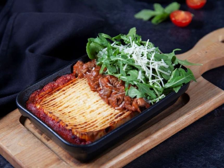 A lasagna dish served in a restaurant at Acclaim Hotel Calgary