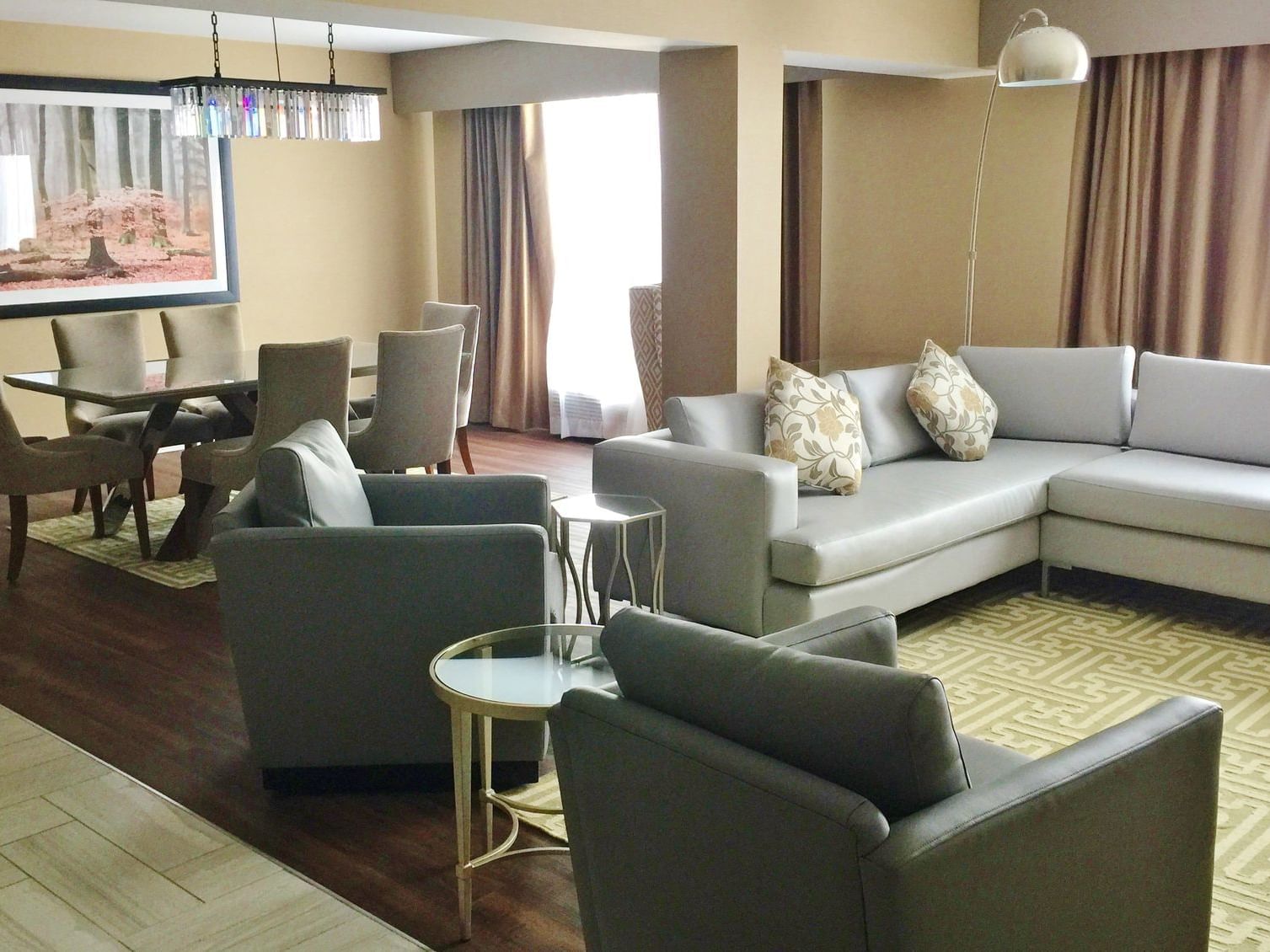 chairs and an l-shapped couch in a hotel room