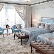 Twin beds, couches in Premier Versace Room at Palazzo Versace