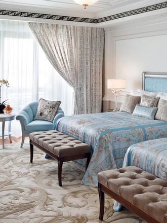 Bedroom with 2 beds and sitting area at Palazzo Versace Dubai