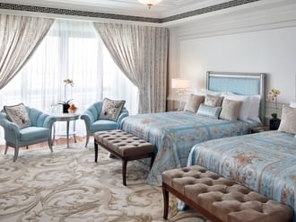 Bedroom with 2 beds and sitting area at Palazzo Versace Dubai
