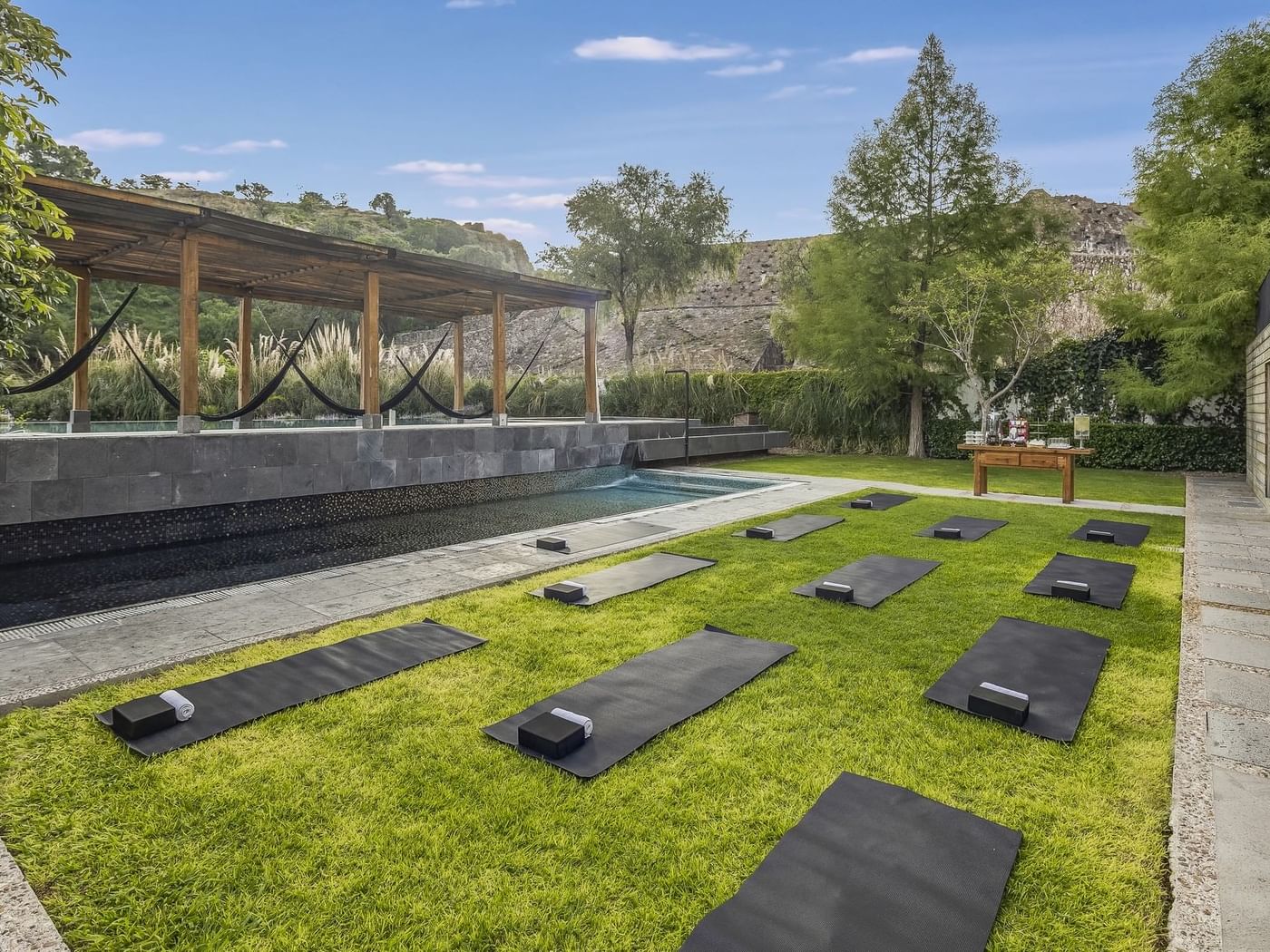Yoga mats laid out on grass in a backyard at Live Aqua Resorts and Residence Club