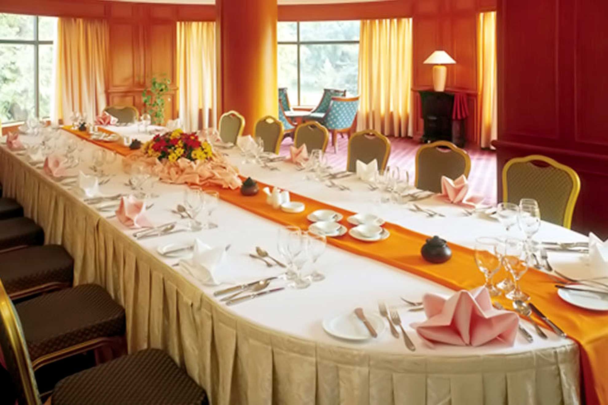 Long table set up with flowers & cutlery for an Event at Sunway Hotel Phnom Penh