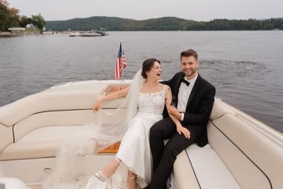 Wedding couple enjoying a Chris Craft boat tour at Schroon Lake Marina in The Lodge at Schroon Lake
