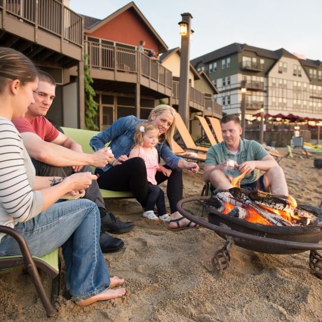 Family enjoying a BBQ on the beach near Chase on The Lake