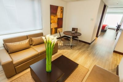 The living area of a room with a couch and a coffee table