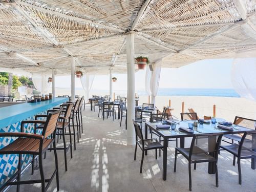 Outdoor dining area with ocean view at Tortugas in Hacienda Del Mar Los Cabos Redesign, Cabo San Lucas.