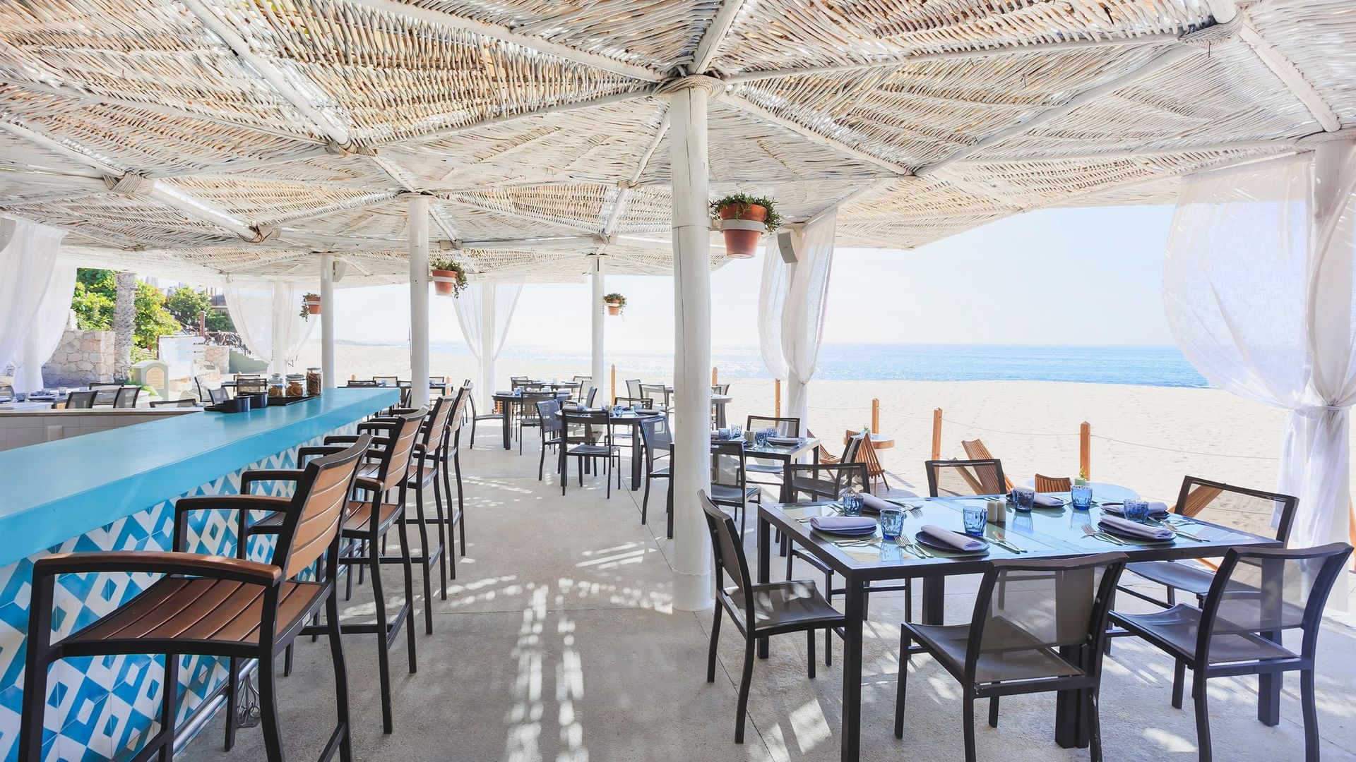 Outdoor dining area with ocean view at Tortugas in Hacienda Del Mar Los Cabos Redesign, Cabo San Lucas.