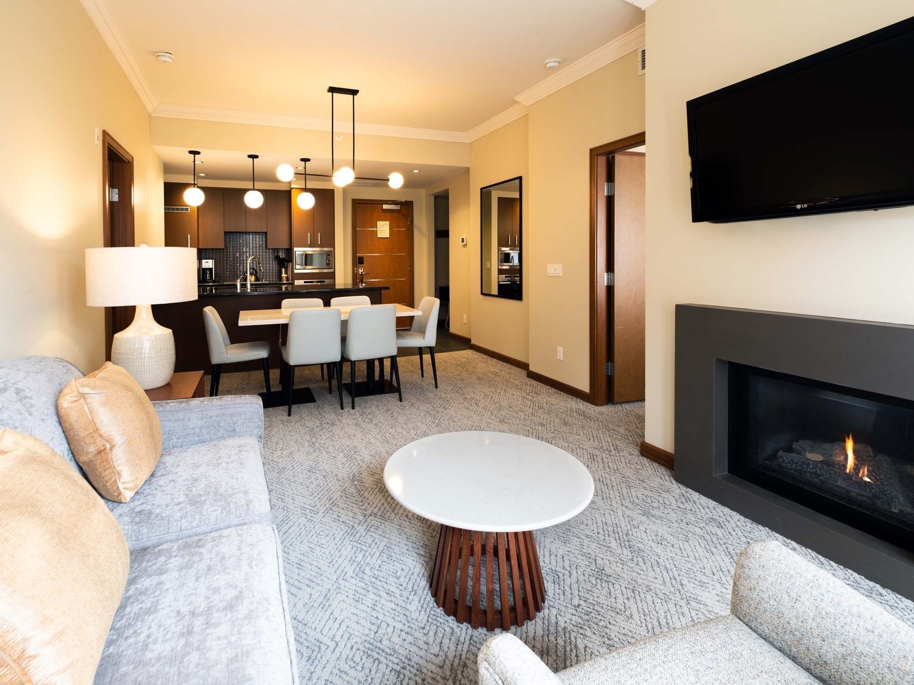 Living room of Two Bedroom Suite with 2 King Beds and Sofa Bed at The Sutton Place Hotel Revelstoke Mountain Resort.