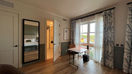 Work desk by the window in King Room With Balcony at Camp Creek Inn