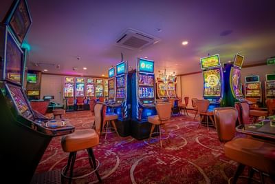 A game room filled with arcade machines in Casino Concorde at Irazu Hotel