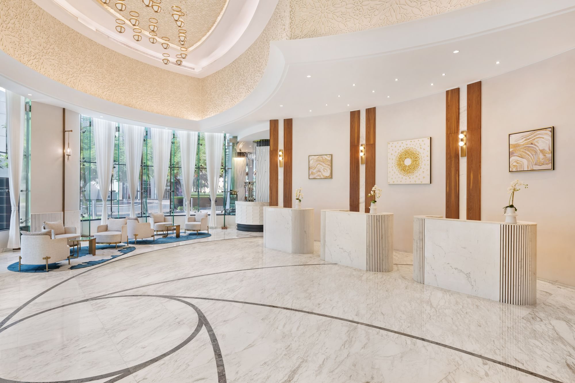 Lobby lounge area with front desks and plush seating at DAMAC Maison Royale The Distinction