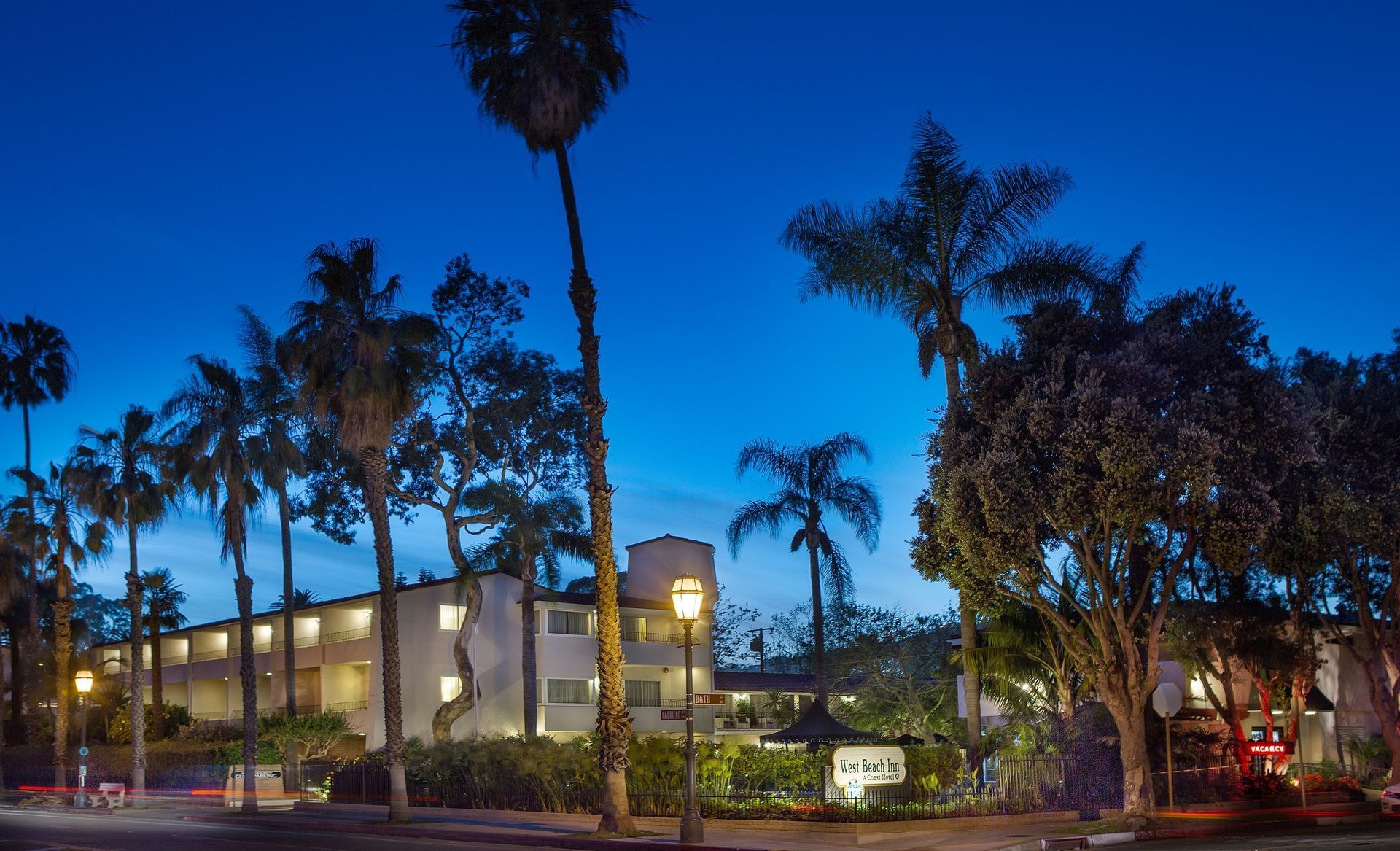 The West Beach Inn, a Coast Hotel - Night Exterior