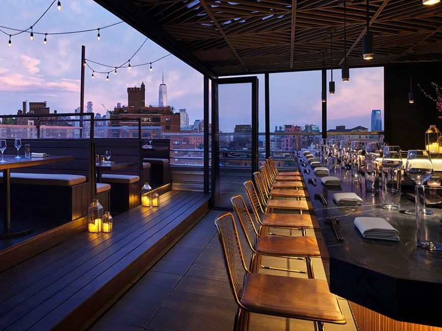 Saishin bar with outdoor seating and Manhattan skyline