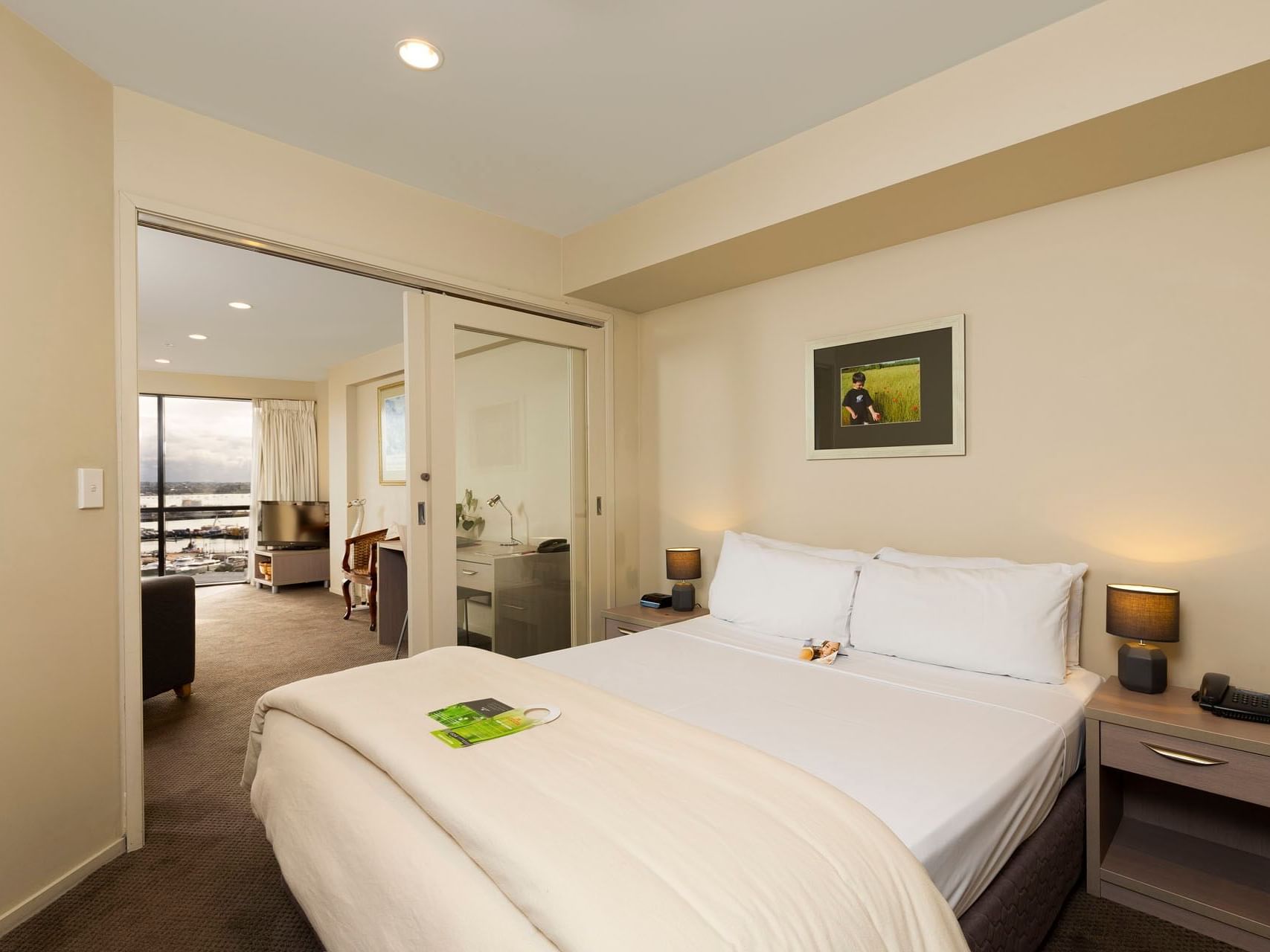 Comfy king bed in One Bedroom Harbour View Room at Hotel Grand Chancellor