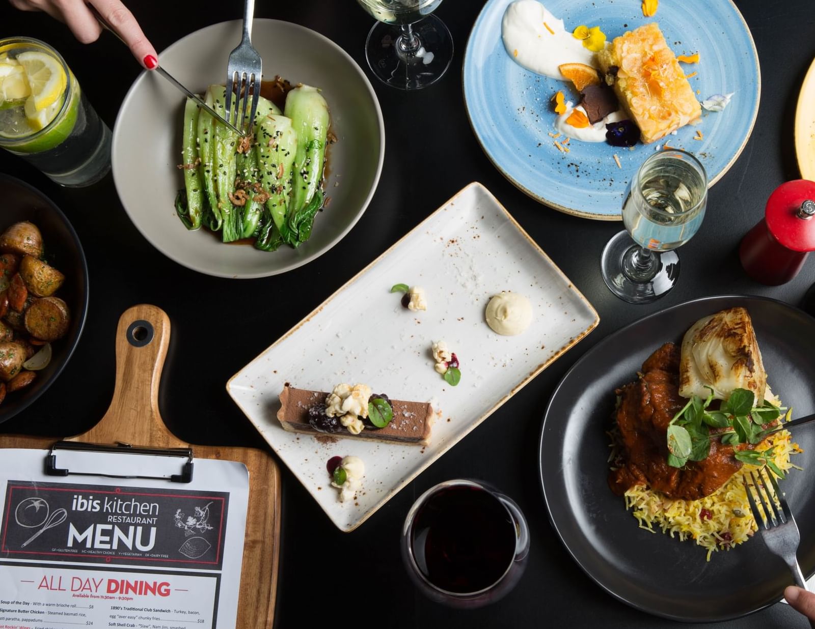 Various gourmet dishes, including desserts and main courses served at Ibis Adelaide
