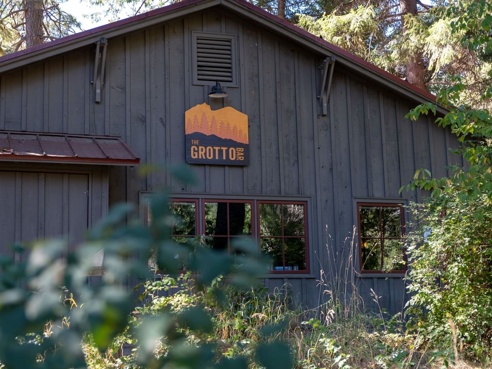 Front view & entrance sign of The Grotto Bar at Sleeping Lady