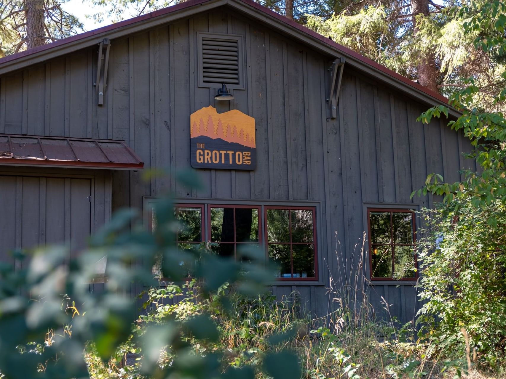 Front view & entrance sign of The Grotto Bar at Sleeping Lady 