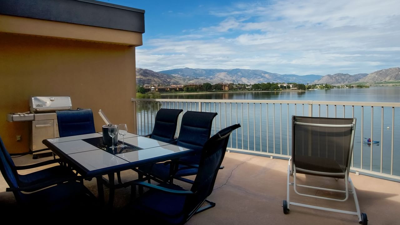 Grill with lake view and chairs to chill