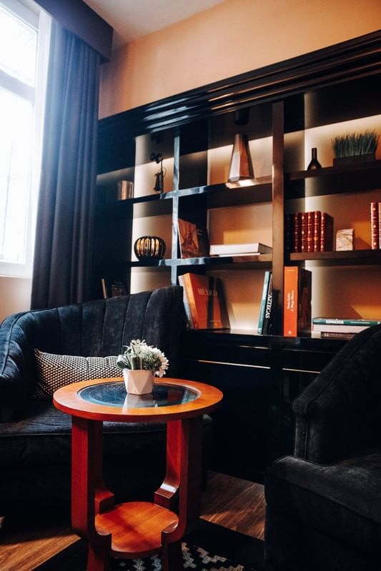 Bookshelf by the lobby lounge area at Casa Mali by Dominion