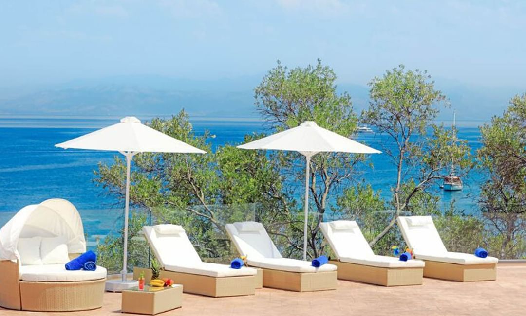 Closeup on the pool with pool chairs at Kairaba Hotel