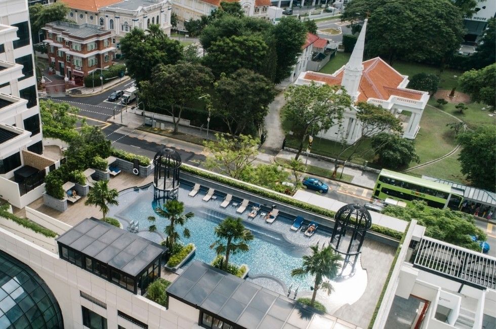 High-angle view of the hotel outdoor pool deck and surrounding city streets at Grand Park City Hall