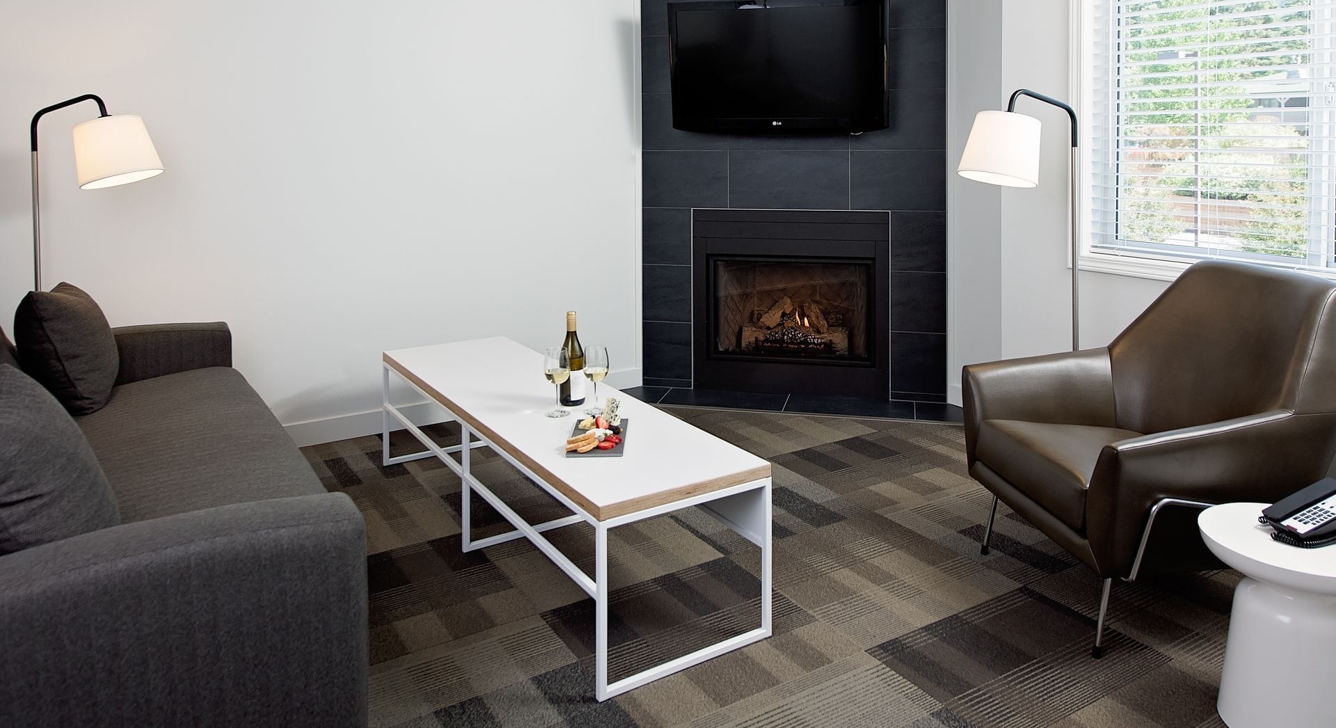 Living room with couch, sofa chair and fireplace