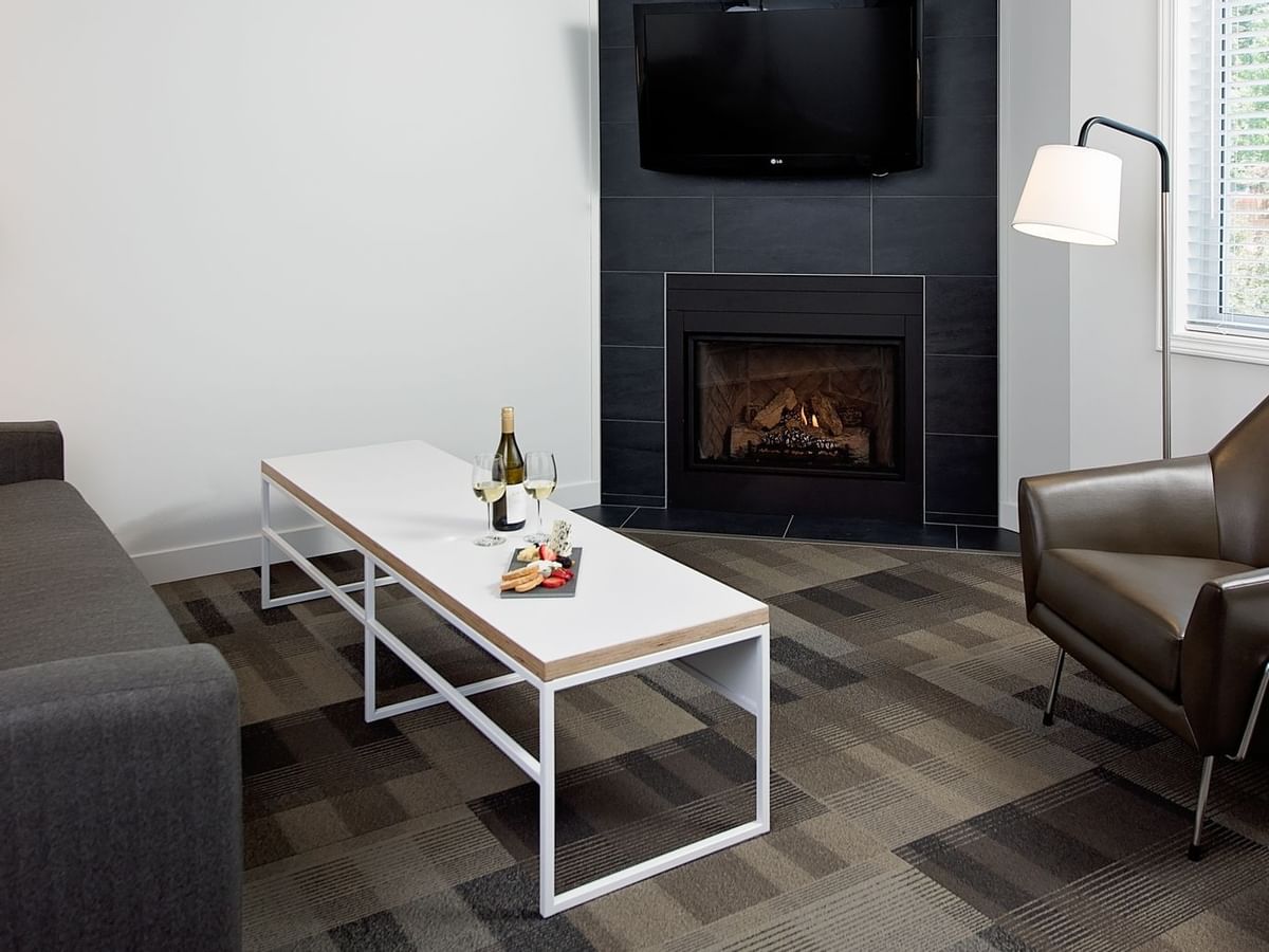 Lounge area of hotel room with fireplace