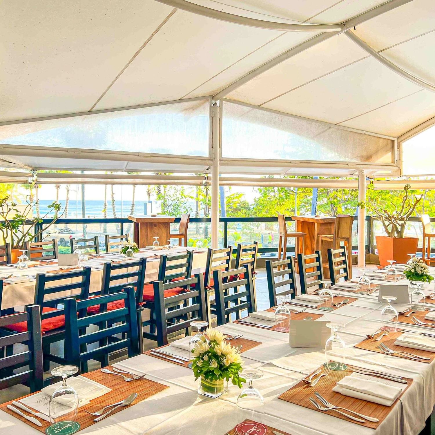  Outdoor private dinner setup at Karon Beach Square with a stunning sea view.