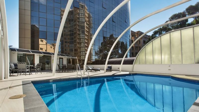 Outdoor swimming pool with clear blue water at Novotel Sydney Parramatta in Parramatta.