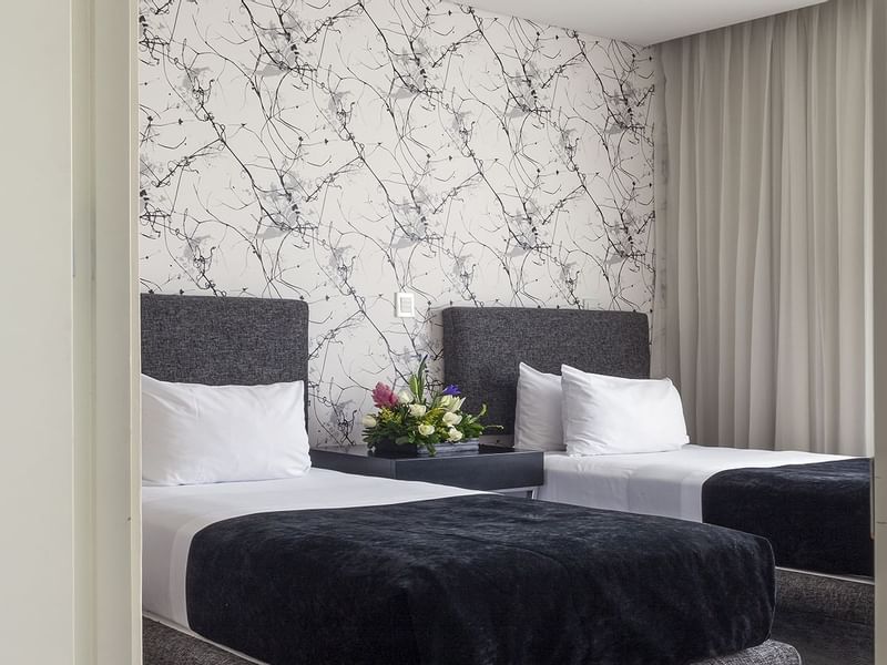 Two single beds in the Superior Room Double at Gamma Hotels