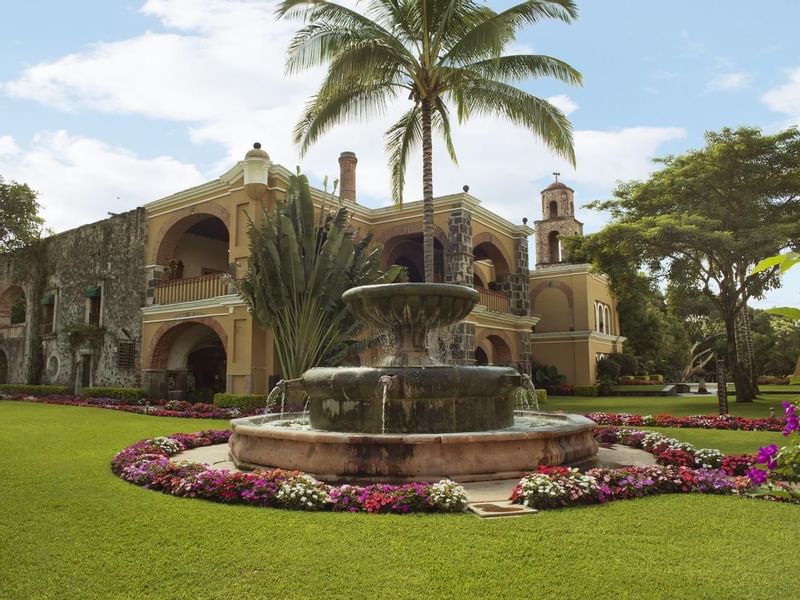 Exterior view of hotel & a fountain at Hacienda San Antonio