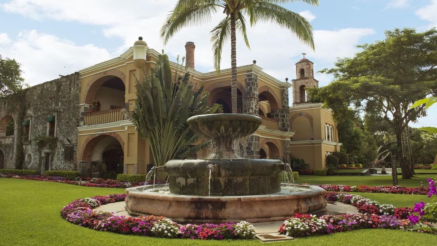 Exterior view of hotel & a fountain at Hacienda San Antonio