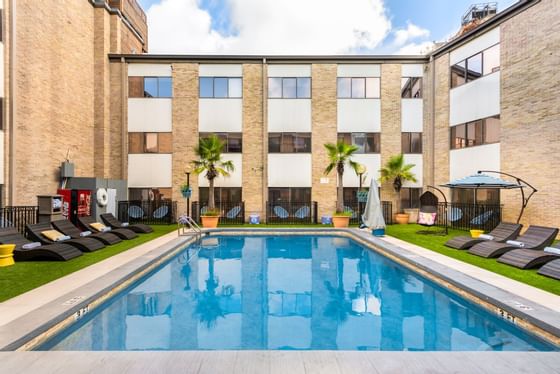 Sunbeds surround the pool at The Riverwalk Plaza Hotel & Suites