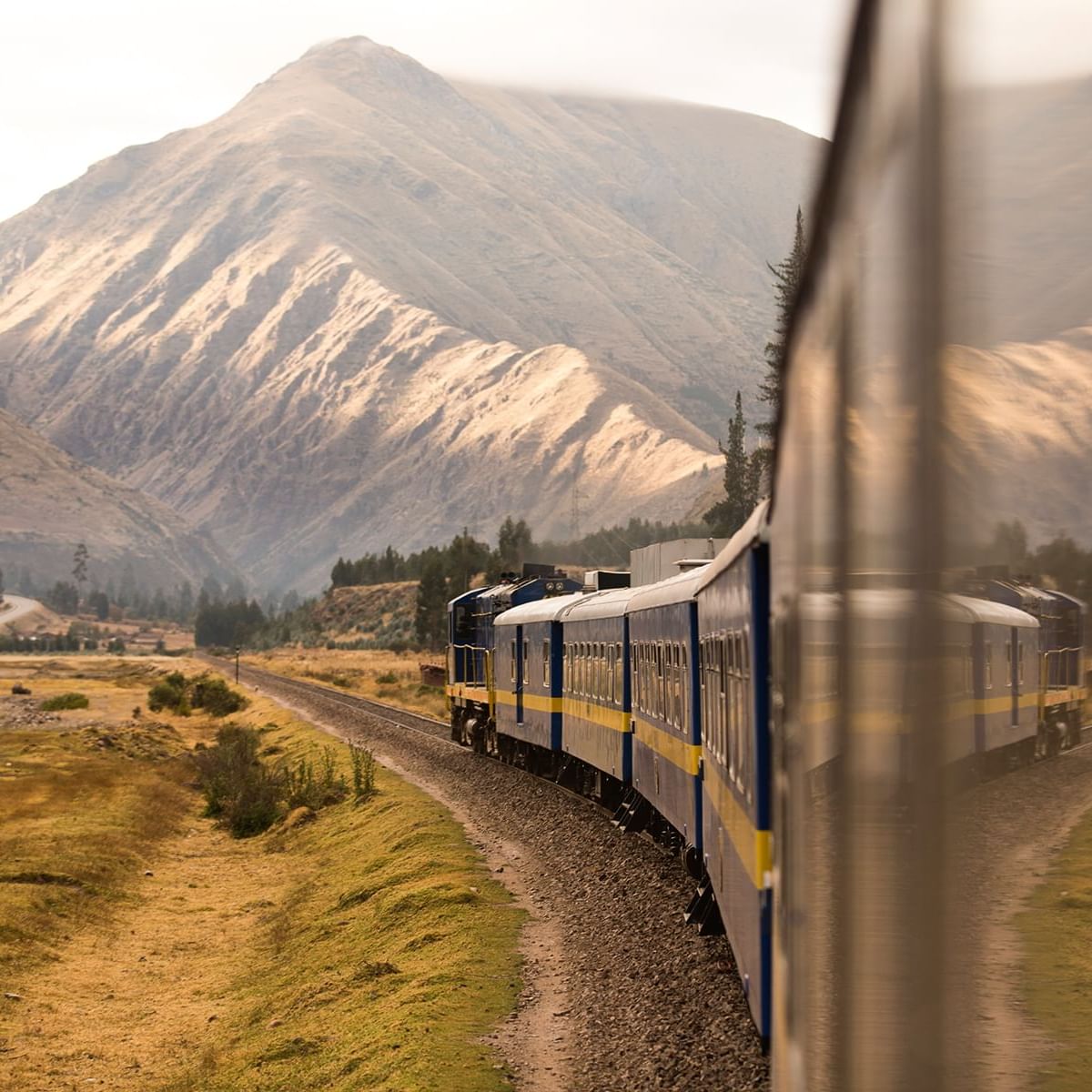 View of the train and mountains on the way to Machu Picchu