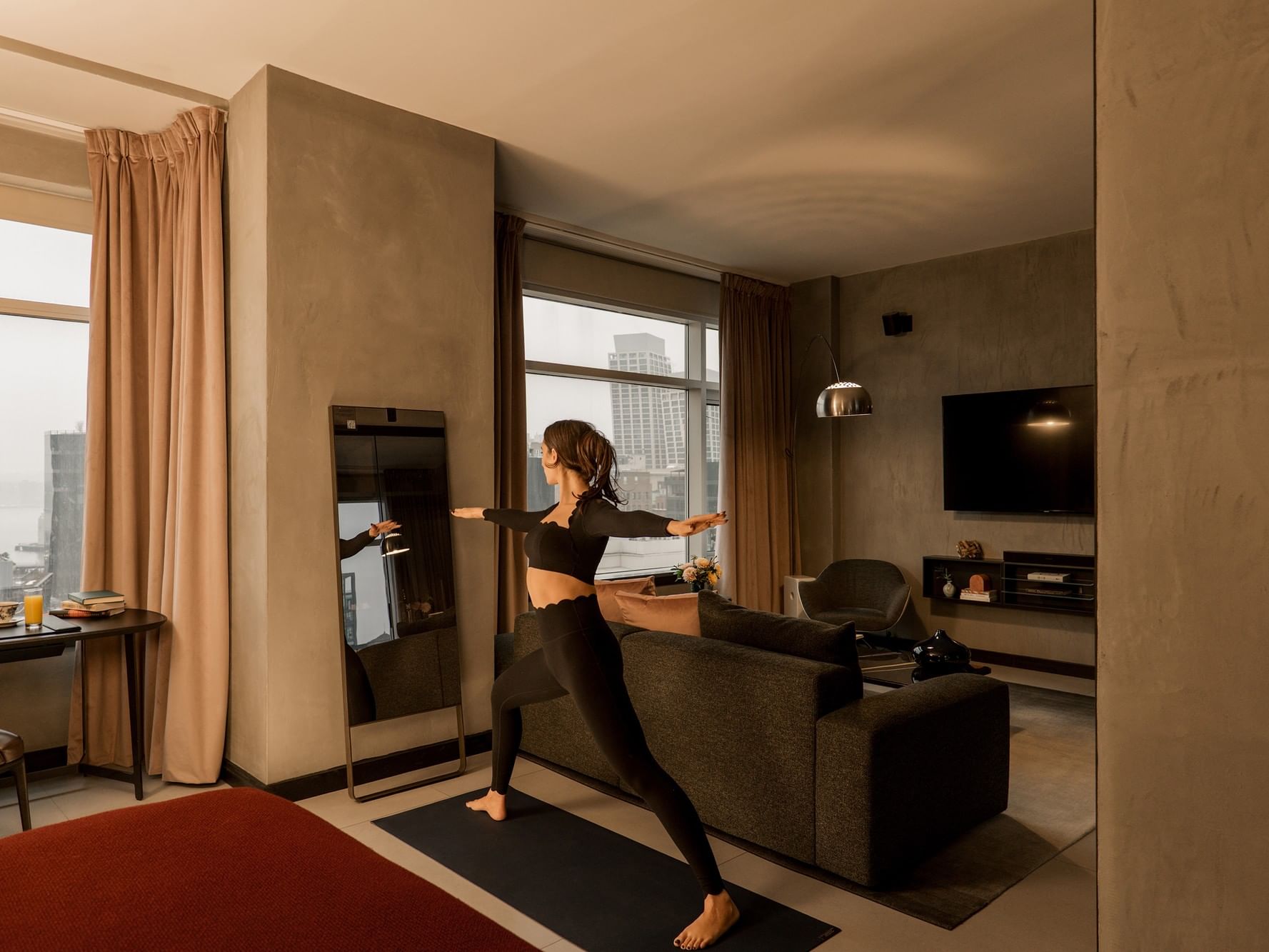 Gansevoort Meatpacking Duplex Penthouse Designed by Poliform. lululemon Studio Mirrors are available for in-room fitness. 
