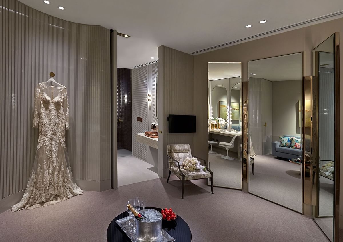A Wedding dress hung in a Hotel room at Crown Hotel Perth