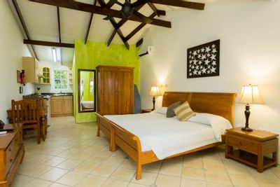 Bed & kitchen in Bay View Rooms at True Blue Bay Resort