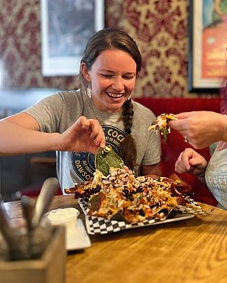 Girl eating nachos