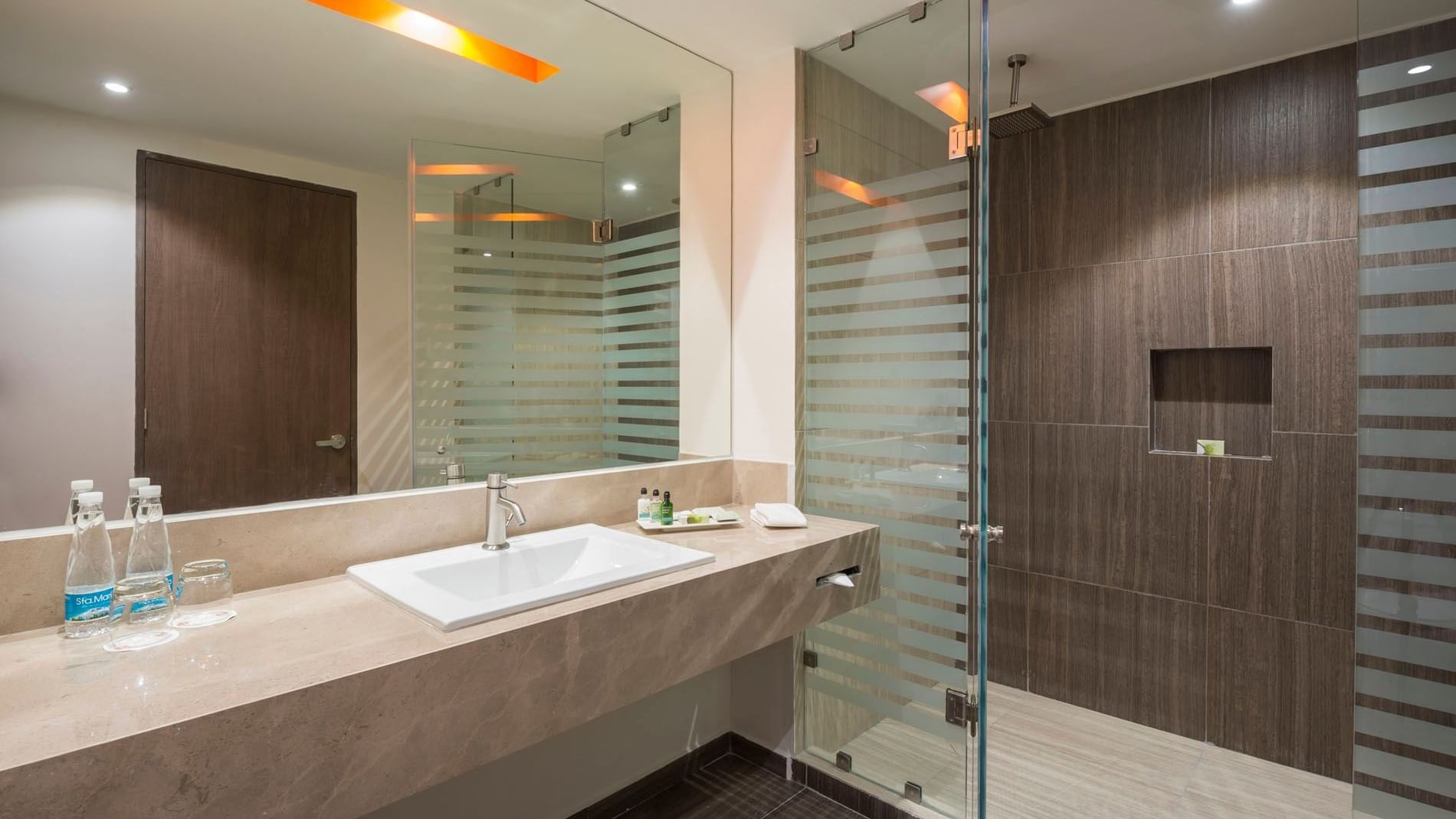 2 Double Superior bathroom featuring a wide marble sink, bright lighting, and a rainfall shower head at Real Inn Celaya