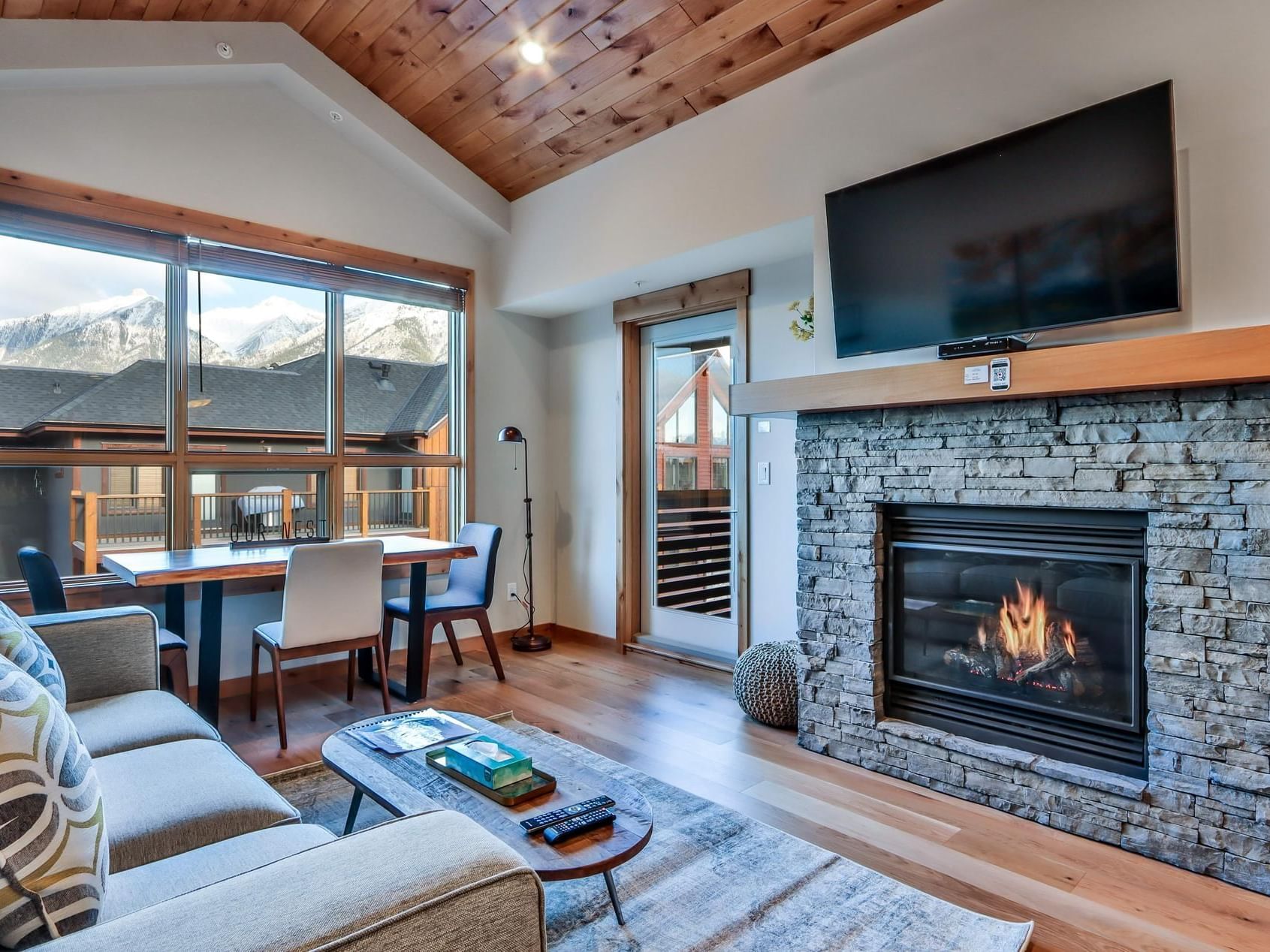 408 White Spruce Lodge One Bedroom Elevated Condo living area with a fireplace at Spring Creek Vacations