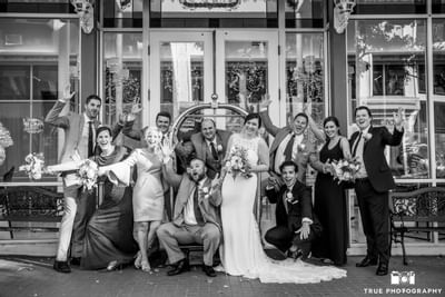 Wedding party posing by the entrance at Horton Grand Hotel